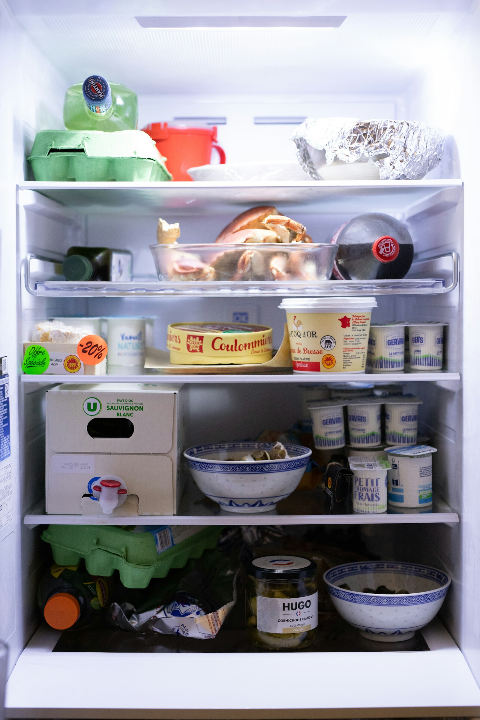 An open refrigerator with shelves full of food